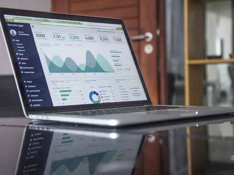 Laptop displaying performance analytics with upward trends